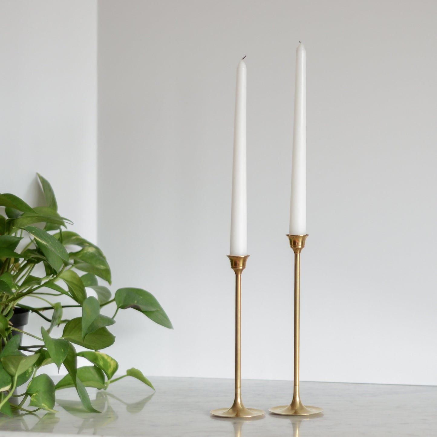 Pair of MCM Slender Brass Candle Holders