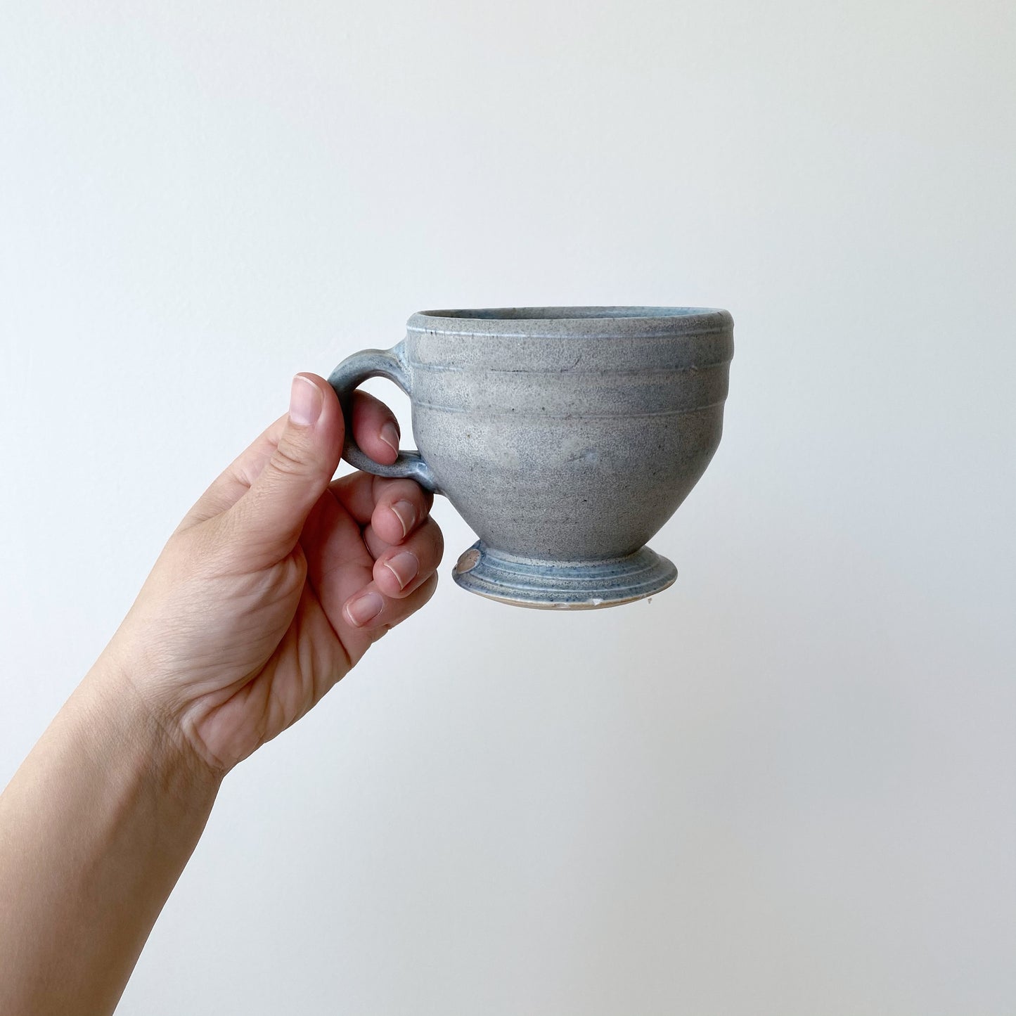 Handcrafted Footed Pottery Mug