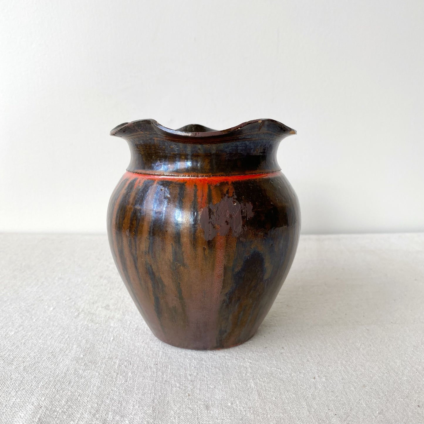 Vintage Black and Red Pottery Vessel with Ruffle Lip