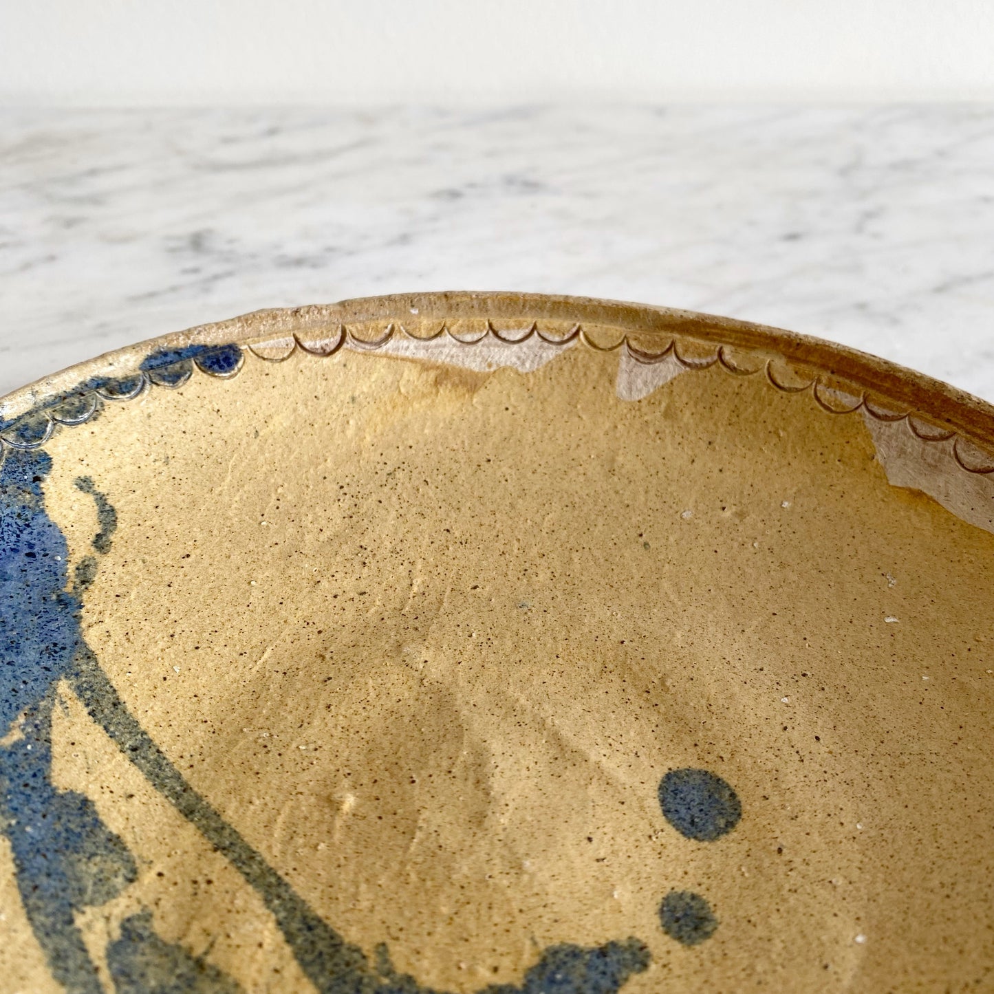 Vintage Pottery Plate with Blue Splatter Design