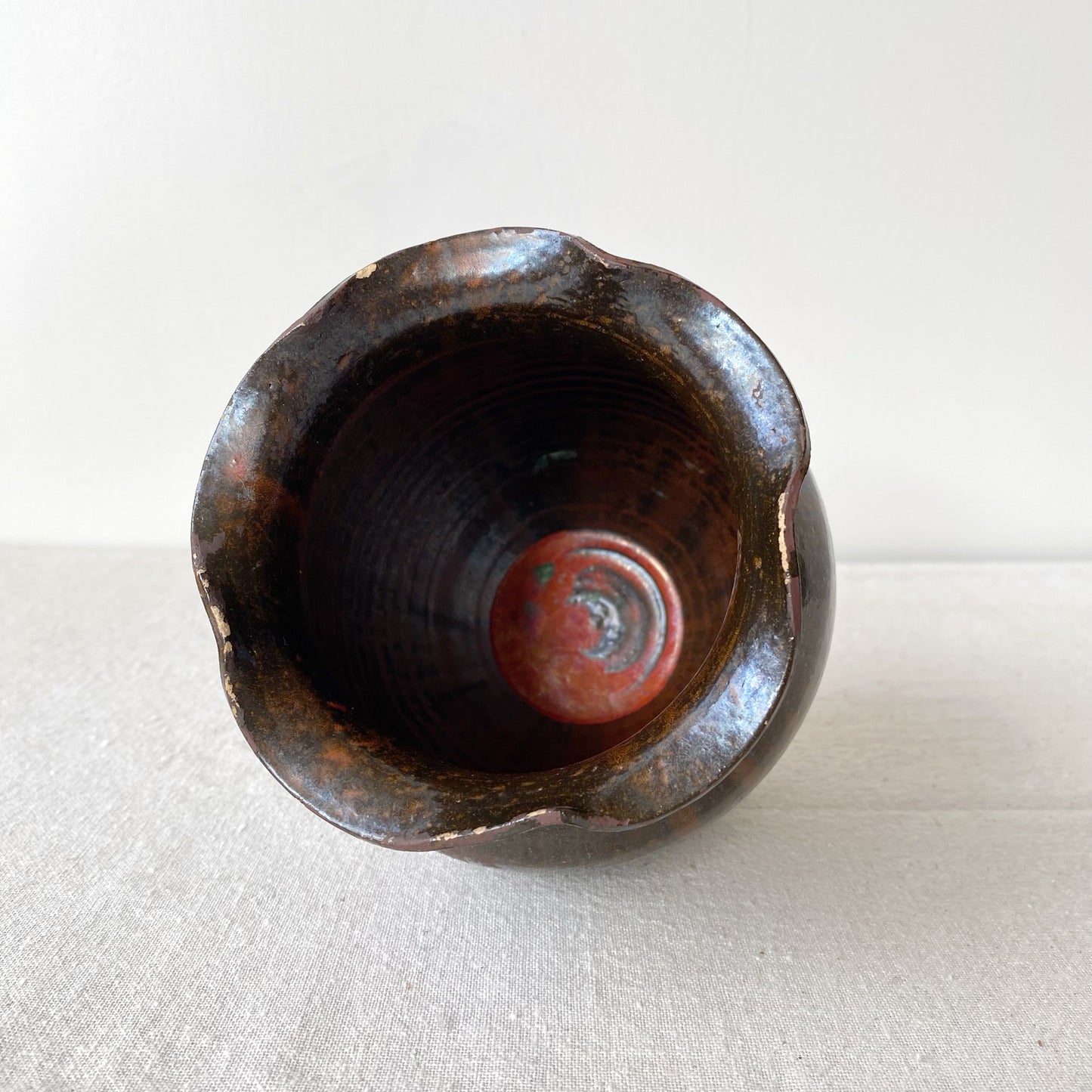 Vintage Black and Red Pottery Vessel with Ruffle Lip