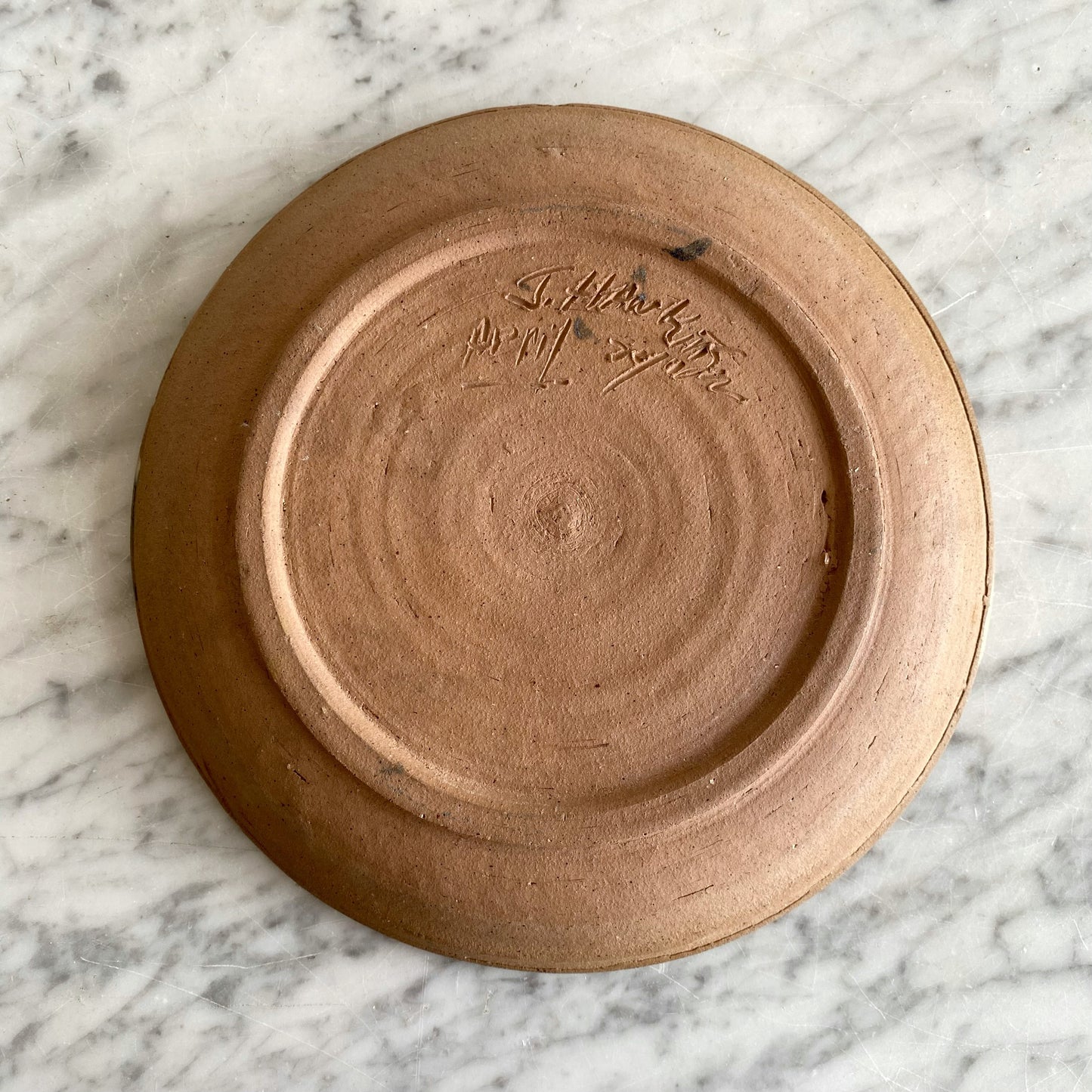 Vintage Pottery Plate with Blue Splatter Design