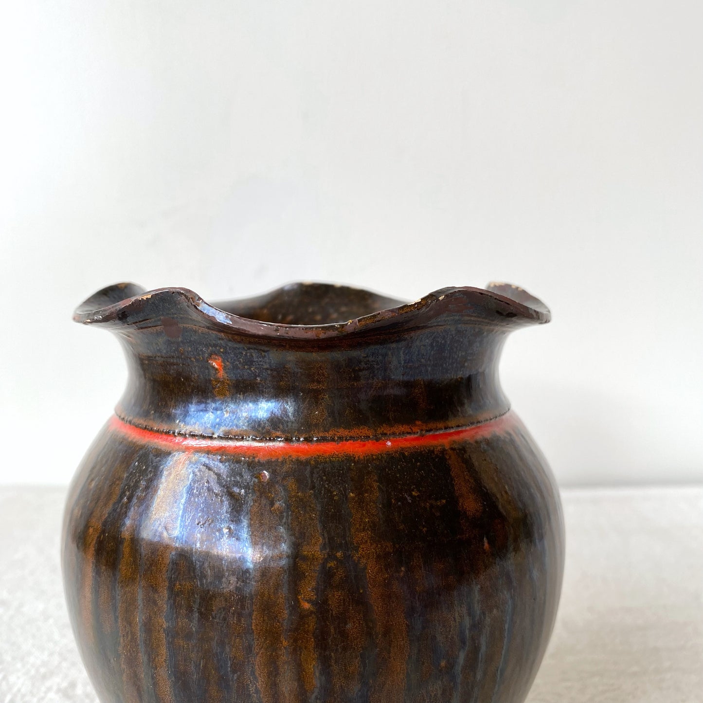 Vintage Black and Red Pottery Vessel with Ruffle Lip