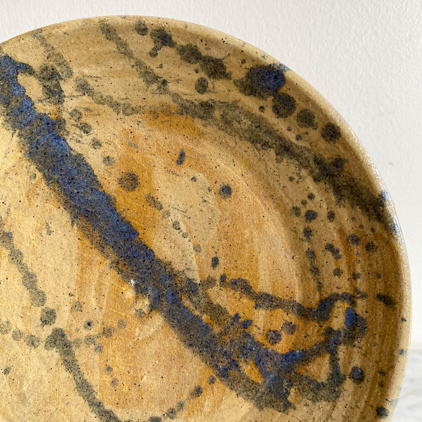 Vintage Pottery Plate with Blue Splatter Design