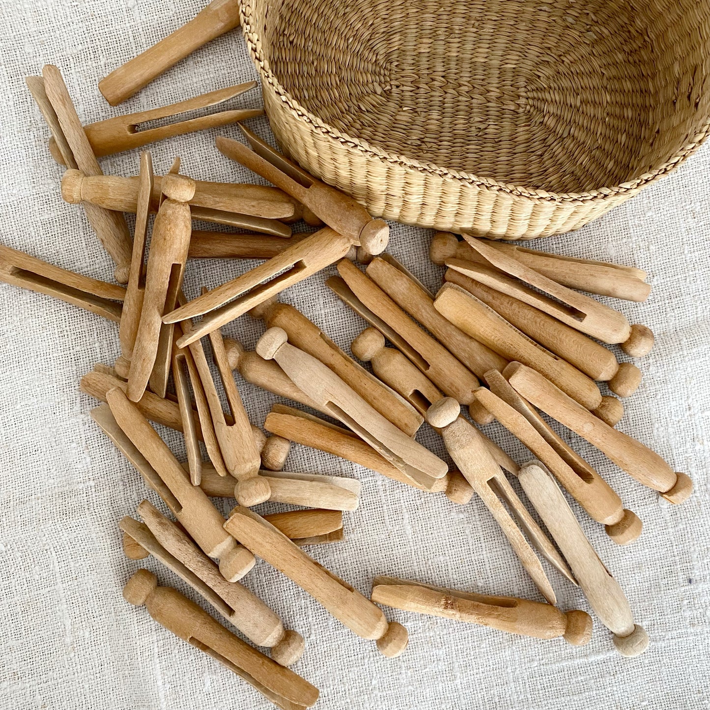 Collection of Vintage Wood Clothespins in Basket