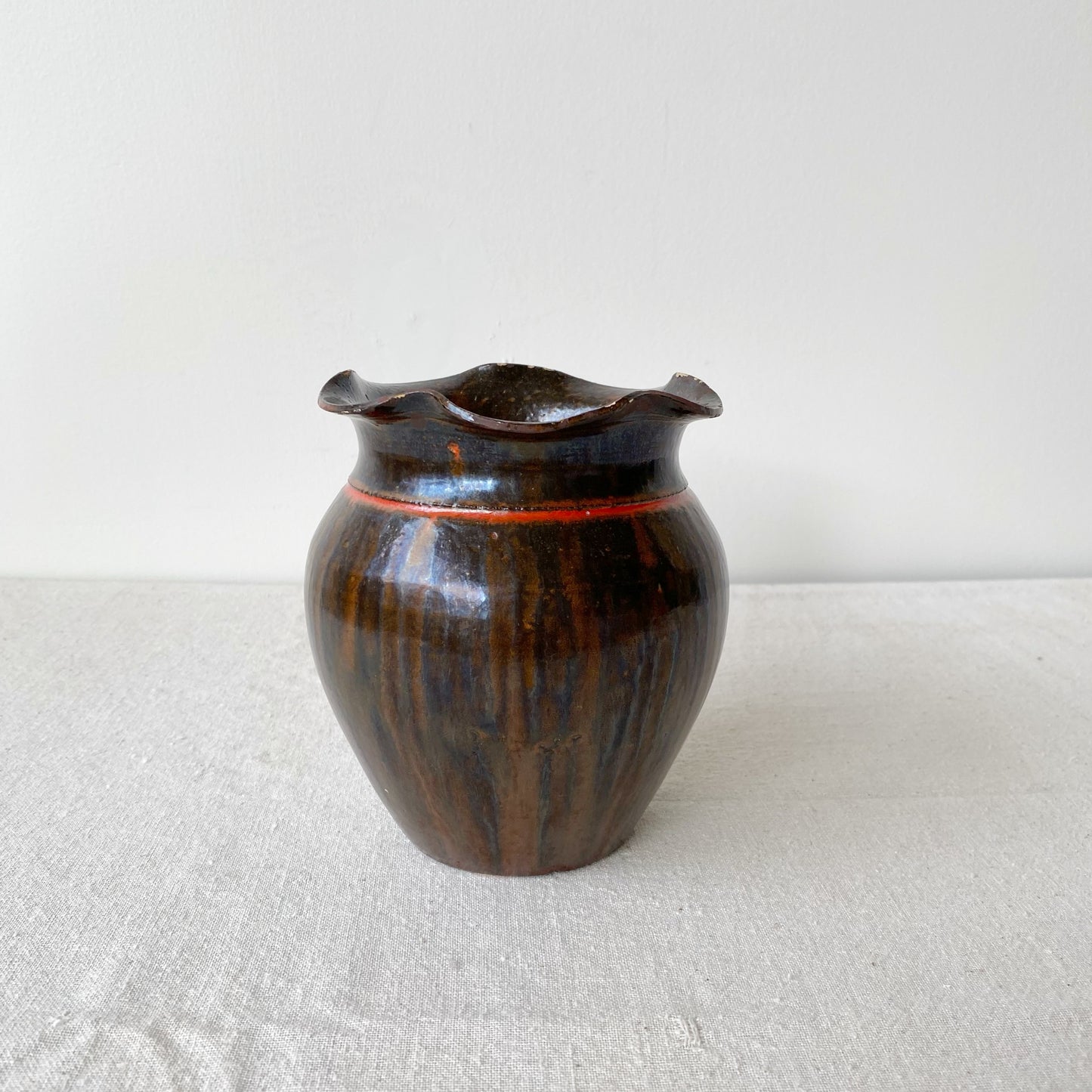 Vintage Black and Red Pottery Vessel with Ruffle Lip