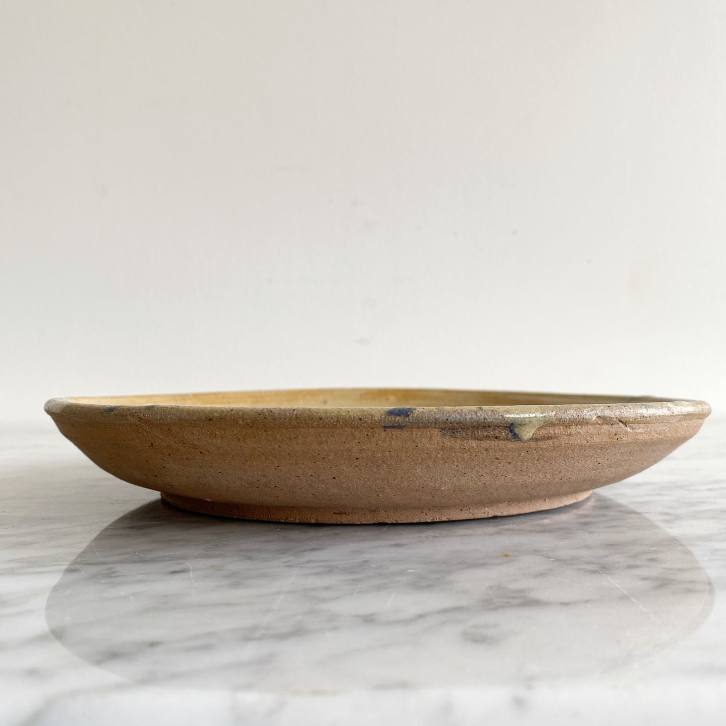 Vintage Pottery Plate with Blue Splatter Design
